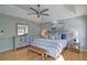 Large primary bedroom suite with hardwood floors, tray ceiling, and neutral decor at 2593 Abbotts Glen Nw Dr, Acworth, GA 30101