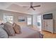 Serene primary bedroom with hardwood floors, tray ceiling and lots of natural light at 2593 Abbotts Glen Nw Dr, Acworth, GA 30101