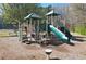 Outdoor community playground featuring climbing structures, slide, and safety surfacing at 2593 Abbotts Glen Nw Dr, Acworth, GA 30101