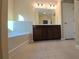 Bathroom featuring a soaking tub, a double sink vanity with dark wood cabinets, and tile flooring at 4440 Cedar Bridge Walk, Suwanee, GA 30024