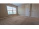 Bedroom featuring carpet, windows for natural light, and closet space at 4440 Cedar Bridge Walk, Suwanee, GA 30024