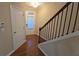 View of entryway, featuring hardwood floors, stairway, and a door with window at 4440 Cedar Bridge Walk, Suwanee, GA 30024