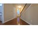View of entryway, featuring hardwood floors, stairway, and a door with window at 4440 Cedar Bridge Walk, Suwanee, GA 30024