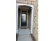Welcoming front door framed by classic columns, enhancing curb appeal at 4440 Cedar Bridge Walk, Suwanee, GA 30024