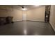 Spacious garage featuring sealed concrete flooring and ample storage space at 4440 Cedar Bridge Walk, Suwanee, GA 30024