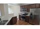 Stylish kitchen featuring stainless steel appliances and granite countertops at 4440 Cedar Bridge Walk, Suwanee, GA 30024