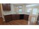 Modern kitchen with granite countertops, stainless steel appliances, and hardwood floors at 4440 Cedar Bridge Walk, Suwanee, GA 30024