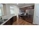 Lovely kitchen with stainless steel appliances and granite counters, ready to cook at 4440 Cedar Bridge Walk, Suwanee, GA 30024
