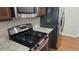 Close up view of stainless steel appliances and granite counter tops at 4440 Cedar Bridge Walk, Suwanee, GA 30024