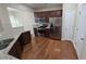 Spacious kitchen showcasing stainless steel appliances and hardwood floors at 4440 Cedar Bridge Walk, Suwanee, GA 30024