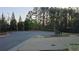 For Sale sign in a tranquil neighborhood with mature trees at 4440 Cedar Bridge Walk, Suwanee, GA 30024