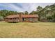 Back exterior showcasing the deck and chimney at 5687 Highway 212, Covington, GA 30016