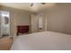 View of neutral colored bedroom and ensuite bathroom at 5687 Highway 212, Covington, GA 30016