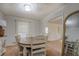 Cozy dining room featuring a round table with six chairs and neutral color palette at 5687 Highway 212, Covington, GA 30016