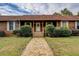 Inviting home with a classic covered front porch and stone walkway at 5687 Highway 212, Covington, GA 30016