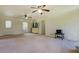 Open living area with carpet flooring, a door to the backyard and natural light at 5687 Highway 212, Covington, GA 30016