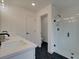Bright bathroom features hexagon tile floors, a glass shower, and plenty of storage at 113 Priestwood Ln, Acworth, GA 30102