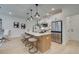 Modern kitchen featuring stainless steel appliances, a large island, and stylish pendant lighting at 113 Priestwood Ln, Acworth, GA 30102