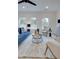Bright living room with large windows, plush seating, and modern decor at 113 Priestwood Ln, Acworth, GA 30102