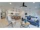 Open-concept living area blending a kitchen island with a comfortable lounge, perfect for modern living at 113 Priestwood Ln, Acworth, GA 30102