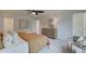 Spacious main bedroom with a ceiling fan, dresser, and adjacent bathroom at 113 Priestwood Ln, Acworth, GA 30102