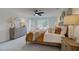 Spacious main bedroom with warm decor, including decorative mirrors, and a ceiling fan at 113 Priestwood Ln, Acworth, GA 30102
