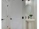 Elegant powder room with pedestal sink and modern fixtures, perfect for guests at 113 Priestwood Ln, Acworth, GA 30102
