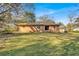 Spacious backyard with lush lawn, brick home, and mature trees is great for entertaining at 2739 Council St, Lithonia, GA 30058