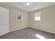 Neutral bedroom with carpeted floors, two windows is perfect for personalizing at 2739 Council St, Lithonia, GA 30058