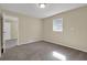 Neutral bedroom with carpeted floors and natural light is perfect for personalizing at 2739 Council St, Lithonia, GA 30058