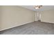 Comfortable living room featuring neutral walls, new carpeting, and a ceiling fan at 2739 Council St, Lithonia, GA 30058