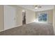 Bright living room with neutral walls, carpeting, back door, and sliding glass doors to a backyard at 2739 Council St, Lithonia, GA 30058