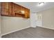Practical utility room featuring wood cabinets for storage and access to the backyard at 2739 Council St, Lithonia, GA 30058
