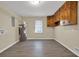 Utility room featuring wood cabinets, shelving, water heater, and lots of natural light at 2739 Council St, Lithonia, GA 30058