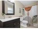 Modern bathroom featuring a black vanity, framed mirror, and decorative shower curtain at 404 Queensbury Pl, Acworth, GA 30102