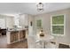 This bright eat-in kitchen features stainless appliances and views to the backyard at 404 Queensbury Pl, Acworth, GA 30102