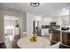 Open concept kitchen with eat-in kitchen table and views to the entryway at 404 Queensbury Pl, Acworth, GA 30102