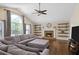 Spacious living room featuring a fireplace, large windows, and a comfortable seating area at 404 Queensbury Pl, Acworth, GA 30102