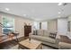 Cozy living room with hardwood floors, neutral paint and large windows at 404 Queensbury Pl, Acworth, GA 30102