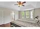 This main bedroom features a bay window, wood floors and an ensuite bathroom at 404 Queensbury Pl, Acworth, GA 30102