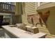Fully equipped outdoor kitchen with grill, sink, and ample counter space at 404 Queensbury Pl, Acworth, GA 30102