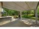 Covered patio featuring an outdoor kitchen, fireplace, and seating area at 404 Queensbury Pl, Acworth, GA 30102