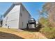 Exterior of home featuring a backyard deck and a sloped yard at 5551 Panola Pl, Lithonia, GA 30058