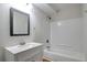 Bathroom featuring a tub, shower, and a stylish sink at 5551 Panola Pl, Lithonia, GA 30058