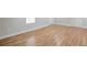 Inviting bedroom with natural light and neutral walls complimented by wood flooring at 5551 Panola Pl, Lithonia, GA 30058