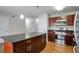 Contemporary kitchen with a granite island, stainless steel appliances, and modern fixtures at 5551 Panola Pl, Lithonia, GA 30058