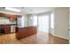 Bright kitchen with stainless steel appliances, granite island, hardwood floors, and a window with natural light at 5551 Panola Pl, Lithonia, GA 30058