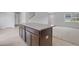Kitchen island with granite countertops, seating, and modern fixtures at 8470 Limerick Lane Dr, Winston, GA 30187