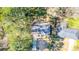 Aerial view of the home shows tree coverage and the roof of the building at 2727 Whites Mill Ct, Decatur, GA 30034