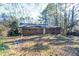 View of the backyard and the back of the home at 2727 Whites Mill Ct, Decatur, GA 30034